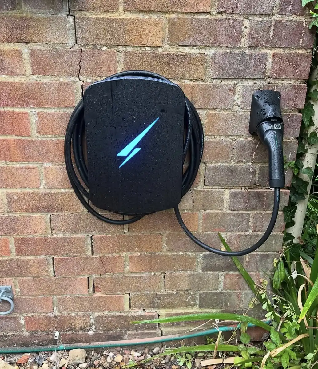 Home EV charger installed on an exterior wall