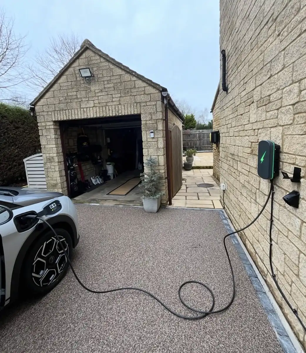 Home EV charger installed on an exterior wall